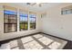 Spacious bedroom with a ceiling fan and a view from a large window at 7275 N Scottsdale Rd # 1001, Paradise Valley, AZ 85253