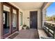 The front entry features a stained wood door, sidelight, and covered porch at 7275 N Scottsdale Rd # 1001, Paradise Valley, AZ 85253