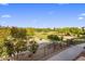 Scenic golf course view from the patio with metal fencing and lush trees at 7275 N Scottsdale Rd # 1001, Paradise Valley, AZ 85253