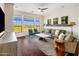 Bright living room featuring hardwood floors, modern decor, and large windows with scenic views at 7275 N Scottsdale Rd # 1001, Paradise Valley, AZ 85253