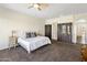 Large main bedroom featuring carpet, a ceiling fan, and closet space at 7275 N Scottsdale Rd # 1001, Paradise Valley, AZ 85253