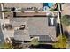 Aerial view of a home with solar panels, a tiled roof, a backyard pool and spa, and lush landscaping at 8817 S 18Th Way, Phoenix, AZ 85042