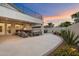 Backyard with a covered patio, seating area, and desert landscaping at 8817 S 18Th Way, Phoenix, AZ 85042