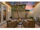 Cozy backyard patio area with a fire pit and string lights, perfect for outdoor entertaining at 8817 S 18Th Way, Phoenix, AZ 85042
