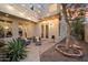 Backyard patio featuring comfortable seating, string lights, desert landscaping and a fire pit at 8817 S 18Th Way, Phoenix, AZ 85042