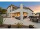 Two story home featuring outdoor living space with patio seating and dining at 8817 S 18Th Way, Phoenix, AZ 85042