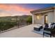 This spacious balcony features a seating area and scenic mountain views at 8817 S 18Th Way, Phoenix, AZ 85042
