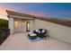 Relax on this cozy balcony with comfy seating and a beautiful sunset view at 8817 S 18Th Way, Phoenix, AZ 85042