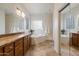 Bathroom featuring double sinks, soaking tub and glass block window at 8817 S 18Th Way, Phoenix, AZ 85042