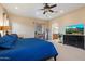 Large bedroom with a king-size bed, desk, and en-suite bathroom at 8817 S 18Th Way, Phoenix, AZ 85042