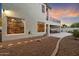 Exterior view showcasing a covered patio with outdoor seating, a second-story balcony, and desert landscaping at 8817 S 18Th Way, Phoenix, AZ 85042