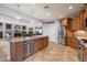 Modern kitchen featuring stainless steel appliances, granite countertops, and a kitchen island at 8817 S 18Th Way, Phoenix, AZ 85042