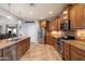Stylish kitchen featuring stainless steel appliances, ample cabinet space, and tile flooring at 8817 S 18Th Way, Phoenix, AZ 85042
