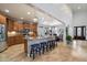 Open kitchen featuring an island with bar stool seating, granite countertops, and stainless steel appliances at 8817 S 18Th Way, Phoenix, AZ 85042
