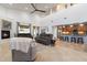 Bright open concept living space with tile flooring, high ceilings, and a cozy fireplace at 8817 S 18Th Way, Phoenix, AZ 85042