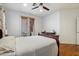 Bright main bedroom featuring hardwood floors and a glass door leading to the backyard at 8817 S 18Th Way, Phoenix, AZ 85042