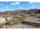 Scenic view of a desert neighborhood nestled at the base of picturesque mountains under a bright blue sky at 8817 S 18Th Way, Phoenix, AZ 85042