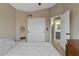 Cozy bedroom showcases neutral walls, ensuite bathroom, and a bright vaulted ceiling at 9509 W Tonopah Dr, Peoria, AZ 85382