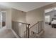 Upstairs hallway with stairs, carpeted floors and views of bedrooms and bonus room at 9509 W Tonopah Dr, Peoria, AZ 85382