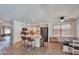 Bright kitchen with stainless steel appliances, modern fixtures, an island and a cozy dining area at 9509 W Tonopah Dr, Peoria, AZ 85382