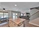 Open kitchen seamlessly flows into living area, featuring island, creating an inviting space for Gathering and guests at 9509 W Tonopah Dr, Peoria, AZ 85382