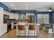 Well lit eat-in kitchen with stainless appliances, breakfast bar, and decorative brown countertops at 9509 W Tonopah Dr, Peoria, AZ 85382