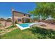 Private backyard oasis with pool, fire pit, outdoor grill, and covered patio, ideal for outdoor living at 9509 W Tonopah Dr, Peoria, AZ 85382