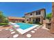 Inviting backyard pool with stepping stones and a patio, perfect for outdoor entertaining and relaxation at 9509 W Tonopah Dr, Peoria, AZ 85382