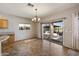Open dining area with tiled floors and a sliding glass door to the outdoor patio at 9722 W Prospector Dr, Queen Creek, AZ 85144