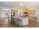 Spacious kitchen with a large island, granite countertops, and stainless steel appliances at 9722 W Prospector Dr, Queen Creek, AZ 85144