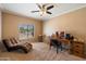 Inviting office with a desk, chair, lounge, and a large window offering outside views at 9722 W Prospector Dr, Queen Creek, AZ 85144