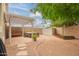 Private backyard featuring a hot tub, pergola, and storage shed, ideal for outdoor relaxation at 9834 E Fairview Ave, Mesa, AZ 85208