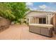Landscaped backyard showcases a hot tub, and private patio at 9834 E Fairview Ave, Mesa, AZ 85208