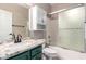 This bathroom features a granite counter, vessel sink, and a bathtub with a glass enclosure at 9834 E Fairview Ave, Mesa, AZ 85208
