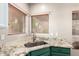 The kitchen sink features granite countertops, wood-look blinds, and stainless steel faucet at 9834 E Fairview Ave, Mesa, AZ 85208