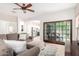 Spacious living room with a neutral-toned sofa, tiled floors, and natural light at 9834 E Fairview Ave, Mesa, AZ 85208