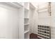 A walk-in closet offers plenty of storage with shelving and storage for shoes at 9834 E Fairview Ave, Mesa, AZ 85208