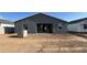 Exterior view of home highlighting the backyard and potential for outdoor living at 15790 W Cheryl Dr, Waddell, AZ 85355