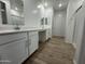 Bathroom features double sinks, framed mirrors, and modern, clean finishes at 15790 W Cheryl Dr, Waddell, AZ 85355