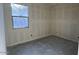 Unfinished bedroom with a large window, ready for customization and finishing touches at 15790 W Cheryl Dr, Waddell, AZ 85355