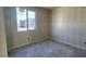 Unfinished bedroom with a large window and ample natural light at 15790 W Cheryl Dr, Waddell, AZ 85355