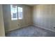 A new home's bedroom offers natural light from a large window at 15790 W Cheryl Dr, Waddell, AZ 85355