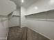 Walk-in closet featuring shelves and metal bars for optimal clothing storage at 15790 W Cheryl Dr, Waddell, AZ 85355