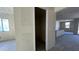 View through the entryway showing the kitchen and living areas in a new home at 15790 W Cheryl Dr, Waddell, AZ 85355