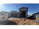 New home showing a gray exterior with a spacious two-car garage at 15790 W Cheryl Dr, Waddell, AZ 85355
