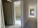 The new home's hallway leads to rooms with plenty of natural light at 15790 W Cheryl Dr, Waddell, AZ 85355