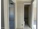Hallway leading to a bathroom and bedroom in new construction home at 15790 W Cheryl Dr, Waddell, AZ 85355