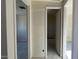 Hallway view showing doors leading to other rooms, highlighting the flow of the home at 15790 W Cheryl Dr, Waddell, AZ 85355