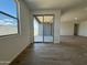Open-plan living area with sliding glass doors to the patio, connecting indoor and outdoor spaces at 15790 W Cheryl Dr, Waddell, AZ 85355