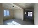 A spacious living area with large windows, ready for personalization at 15790 W Cheryl Dr, Waddell, AZ 85355